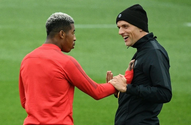Le défenseur du PSG Presnel Kimpembe et son entraîneur Thomas Tuchel lors d'un entraînement le 2 octobre 2018 à Saint-Germain-en-Laye près de Paris 