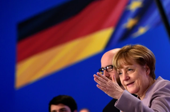 La Chancelière allemande Angela Merkel répond aux questions des journalistes avant le congrès des délégués de l'Union chrétienne-démocrate (CDU), le 5 décembre 2016 à Essen