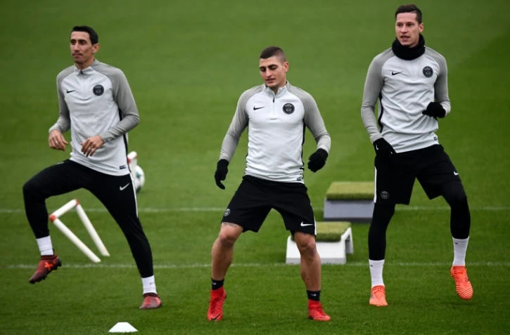 Julian Draxler (d) avec ses coéquipiers Marco Verratti et Angel Di Maria à l'entraînement du PSG au Camp des Loges, le 21 novembre 2017