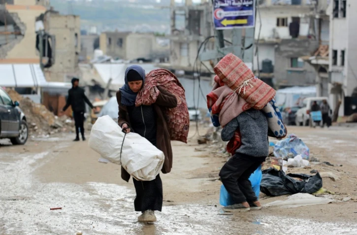 Des Palestiniens fuient Beit Lahia, dans le nord de la bande de Gaza, le 21 mars 2025