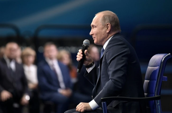 Le président russe Vladimir Poutine s'exprime le 30 janvier 2018 à Moscou à son QG de campagne pour la présidentielle de mars prochain