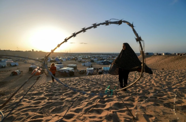 Des enfants dans un camp de déplacés à Rafah, dans le sud de la bande de Gaza, à la veille du mois sacré de ramadan, le 10 mars 2024