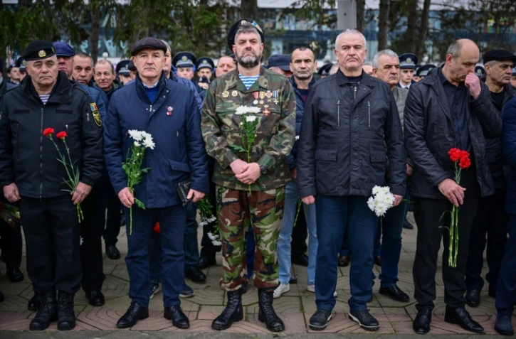 Des vétérans moldaves lors d'une cérémonie à la mémoire des victimes tombées lors de la guerre de sécession de la Transdniestrie, le 2 mars 2024 à Chisinau