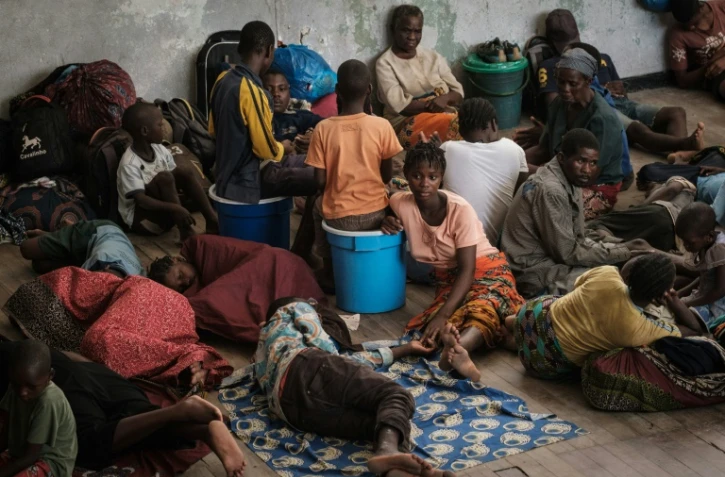 Des personnes touchées par le passage du cyclone Idai trouvent refuge dans une école à Beira, au Mozambique le 21 mars 2019 