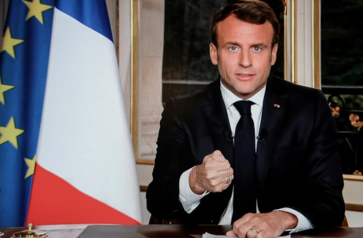 Le président Emmanuel Macron s'adressant aux Français dans une allocution télévisée à Paris le 16 avril 2019