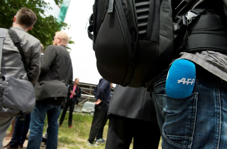 Reporter de l'Agence France-Presse TV lors d'une conférence de presse à Berlin le 3 juin 2014