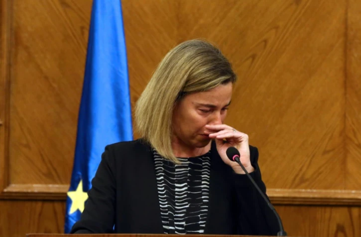 La chef de la diplomatie européenne Federica Mogherini pleure après avoir appris la nouvelle des attentats de Bruxelles pendant une conférence de presse conjointe avec le ministre jordanien des Affaires étrangères le 22 mars 2016 à Amman