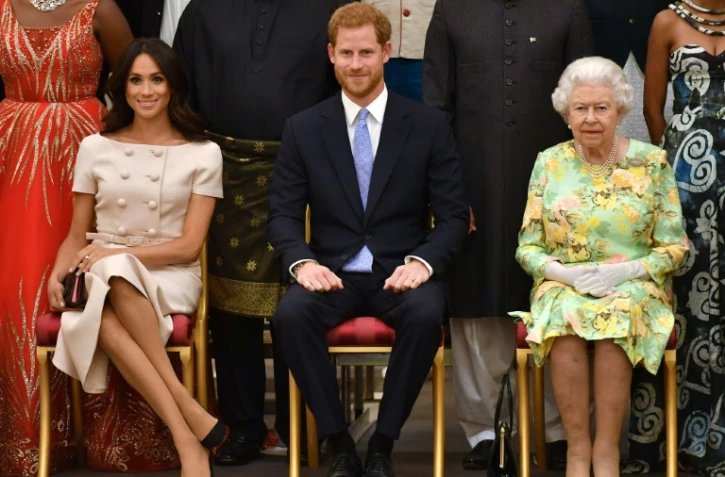 Meghan Markle, le prince Harry et la reine Elizabeth II à Bunckingham Palace, en juin 2018