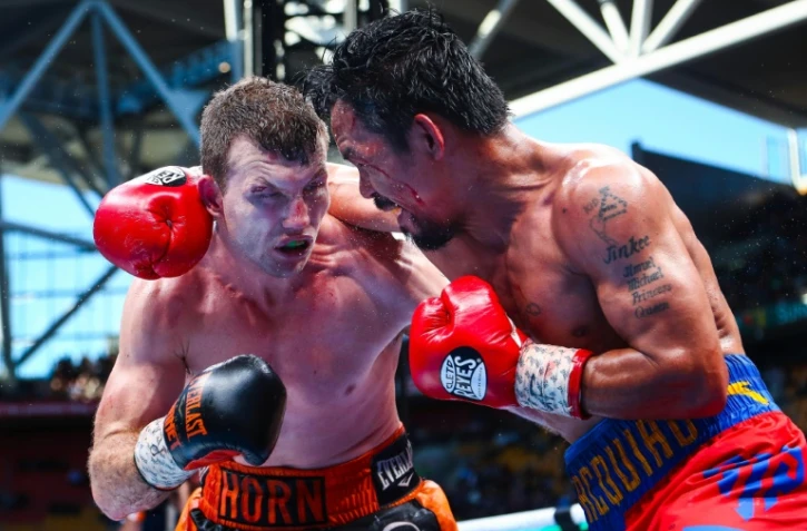 L'Australien Jeff Horn (g), face à la star philippine Manny Pacquiao, décroche le titre WBO des welters, à l'issue d'un combat en 12 reprises, le 1er juillet 2017 à Brisbane 