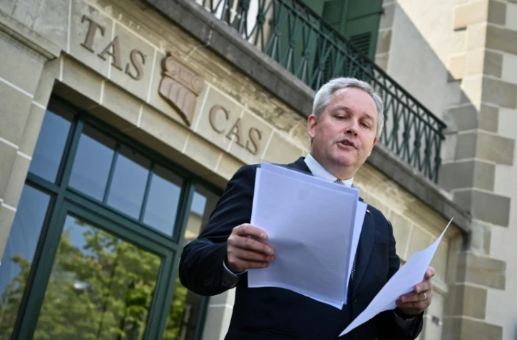 Le secrétaire général du Tribunal arbitral du sport, Matthieu Reeb, lit la décision du tribunal concernant le recours de l'athlète Caster Semenya, à Lausanne, le 1er mai 2019