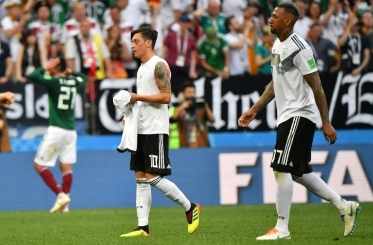 Jerome Boateng (r) has said it is unfair to single out Mesut Ozil (l) as the scapegoat for Germany's early World Cup exit.