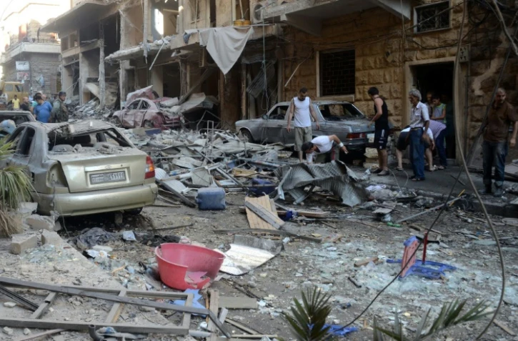 L'ancien quartier Syriac, l'un des secteurs tenus par le régime, après un bombardement rebelle le 11 juillet 2016 à Alep