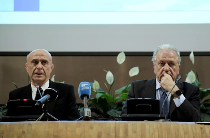 Le ministre de l'Intérieur italien Marco Minniti (G) et le commissaire européen chargé des migrations Dimitris Avramopoulos, le 20 mars 2017 à Rome