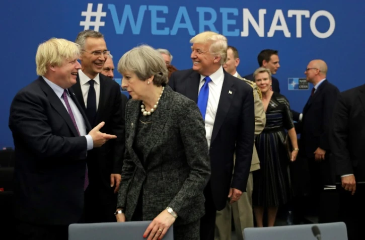 Le futur Premier ministre britannique Boris Johnson, la Première ministre sortante Theresa May et le président des Etats-Unis Donald Trump, ici lors d'une réunion de l'Otan à Bruxelles en mai 2017, alors que le premier était encore ministre des Affaires étrangères