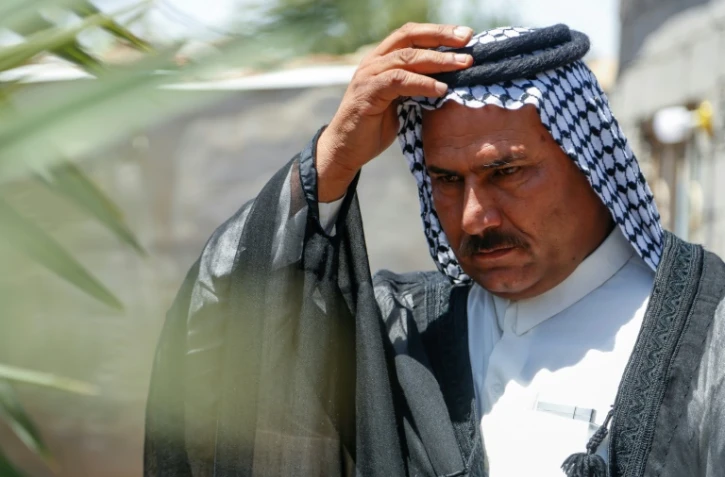 Haydar Mohamed se tient dans la maison où sa famille s'est installée à Kerbala, au sud de Bagdad, en Irak, le 28 avril 2023