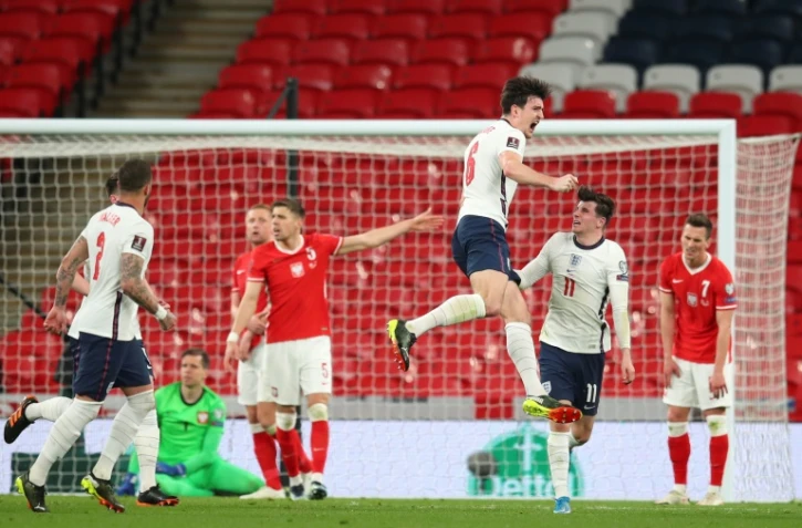 La joie du défenseur anglais Harry Maguire, après avoir marqué le 2e but pour son équipe face à la Pologne, lors de leur match de qualifications pour le Mondial-2022, le 31 mars 2021 au stade de Wembley à Londres