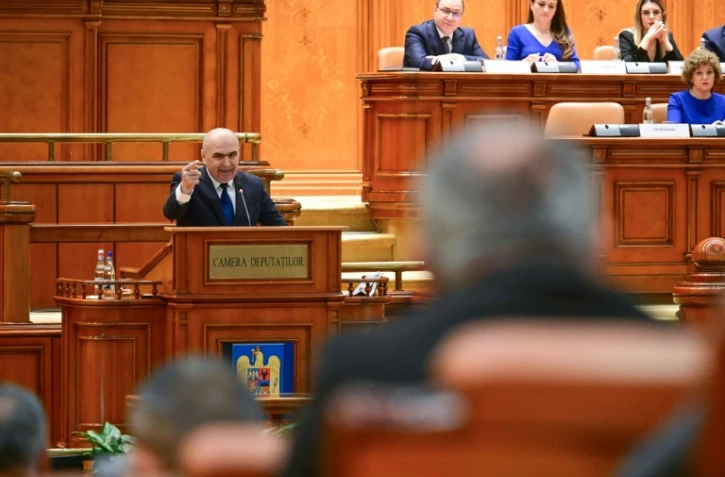 Le Premier ministre roumain sortant Ilie Bolojan au Parlement à Bucarest le 5 mai 2026