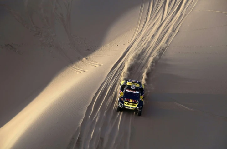 Le Français Sebastien Loeb, au volant d'une Peugeot, remporte la 2e étape du rally Dakar-2019, le 8 janvier, entre Pisco et San Juan de Marcona, au Pérou
