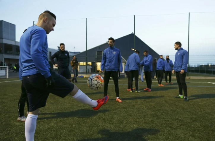 L'équipe de l'US US Granville à l'entraînement sur sa pelouse, en vue du match contre l'OM en Coupe de France, le 29 février 2016