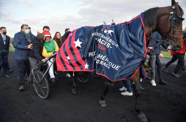 Le trotteur français Davidson du Pont drivé par Nicolas Bazire a remporté  le 101e Prix d'Amérique, l'hippodrome de Paris-Vincennes, le 30 janvier 2022