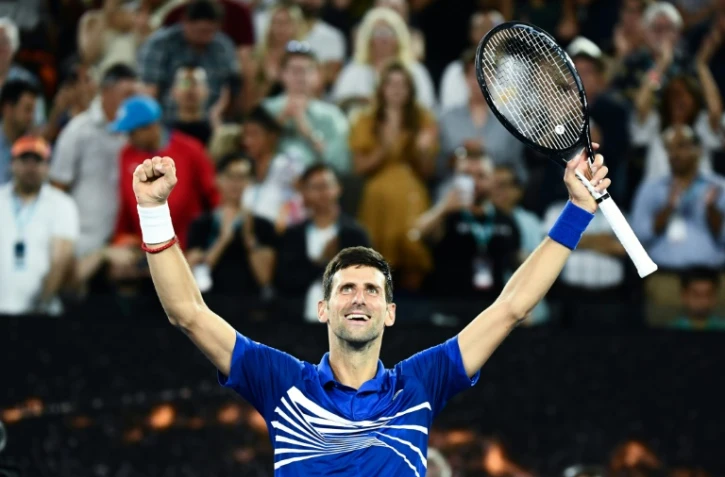 Le Serbe Novak Djokovic exulte après sa victoire face au Français Lucas Pouille en demi-finales de l'Open d'Australie, le 25 janvier 2019 à Melbourne