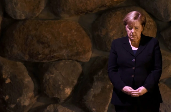 La chancelière allemande Angela Merkel participe à une cérémonie au mémorial de la Shoa à Jérusalem, le 4 octobre 2018