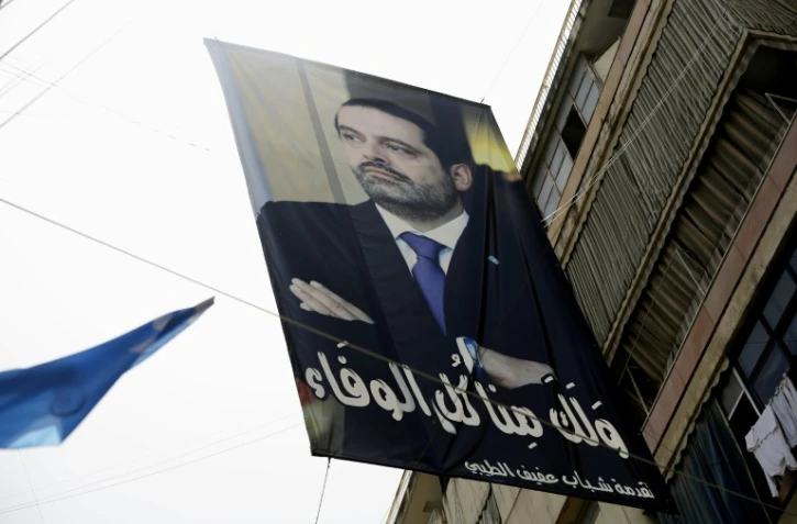 Un portrait du Premier ministre libanais Saad Hariri entre deux bâtiments dans le quartier sunnite de Tariq al-Jadida à Beyrouth, le 4 mai 2018