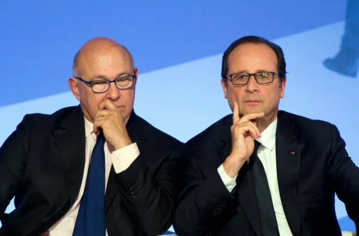 Michel Sapin et François Hollande le 15 septembre 2014 à l'Elysée à Paris