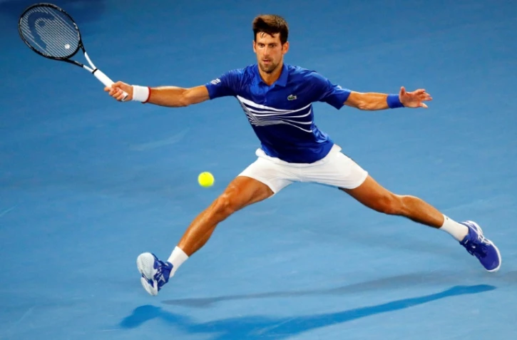 Novak Djokovic face à Jo-Wilfried Tsonga au 2e tour de l'Open d'Australie, à Melbourne, le 17 janvier 2019