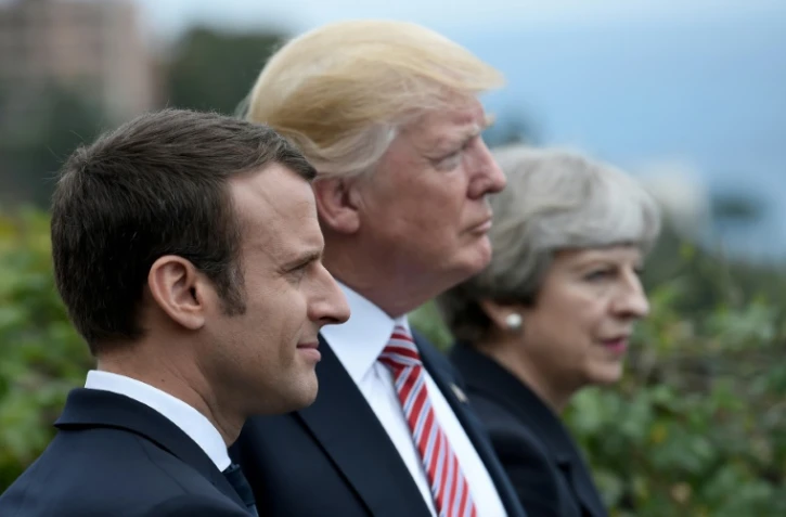 Le président français Emmanuel Macron, le président américain Donald Trump et la Première ministre britannique Theresa May, lors du sommet du G7 à Taormina en Sicille, le 26 mai 2017