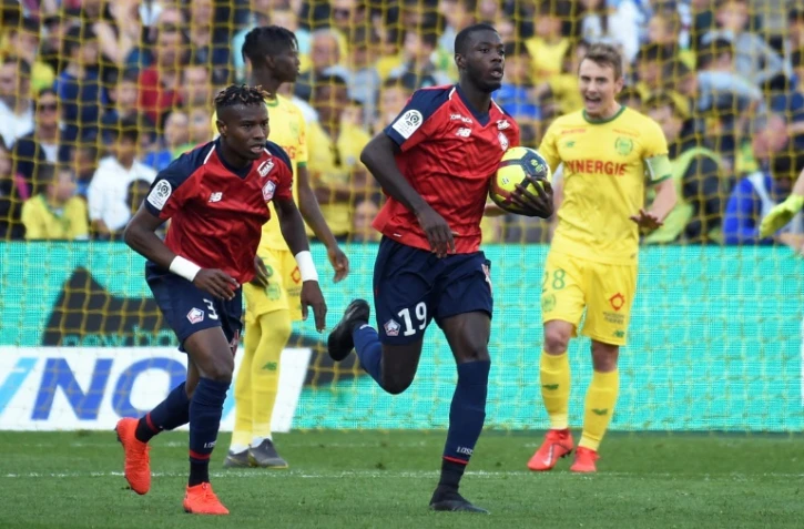 L'attaquant de Lille Nicolas Pépé (d) buteur lors de la victoire sur Nantes 3-2 en 30e journée de L1 le 31 mars 2019