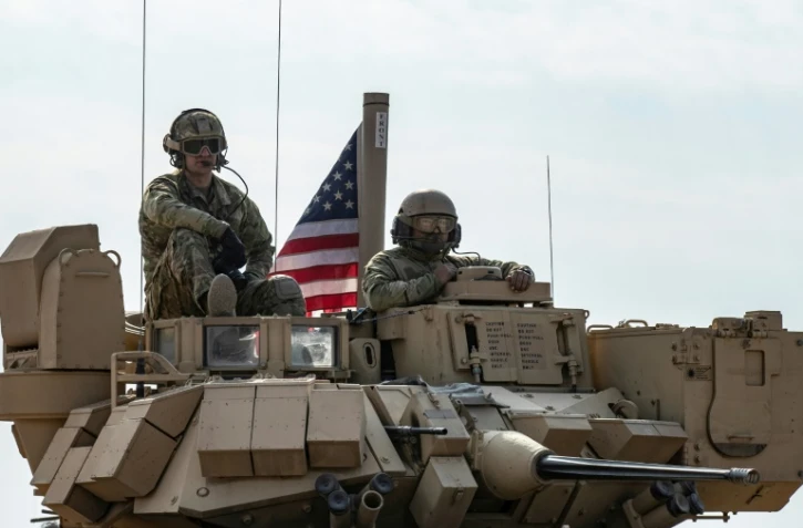Des soldats américains en patrouille près de Tal Hamis, le 26 janvier 2023 au sud-ouest de Qameshli, en Syrie
