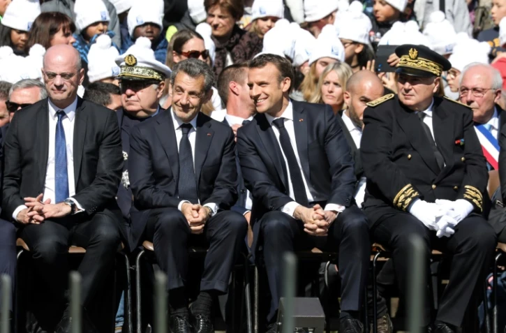 De gauche à droite: Jean-Michel Blanquer, Nicolas Sarkozy, Emmanuel Macron et le préfet de Savoie Pierre Lambert lors de la cérémonie d'hommage aux résistants des Glières, le 31 mars 2019 à Thônes