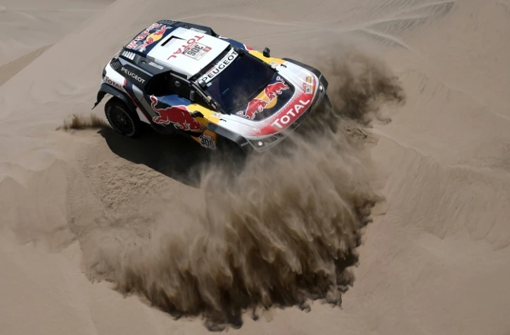 Sébastien Loeb (Peugeot) et son copilote Daniel Elena lors de la 4e étape du Dakar le 9 janvier 2018