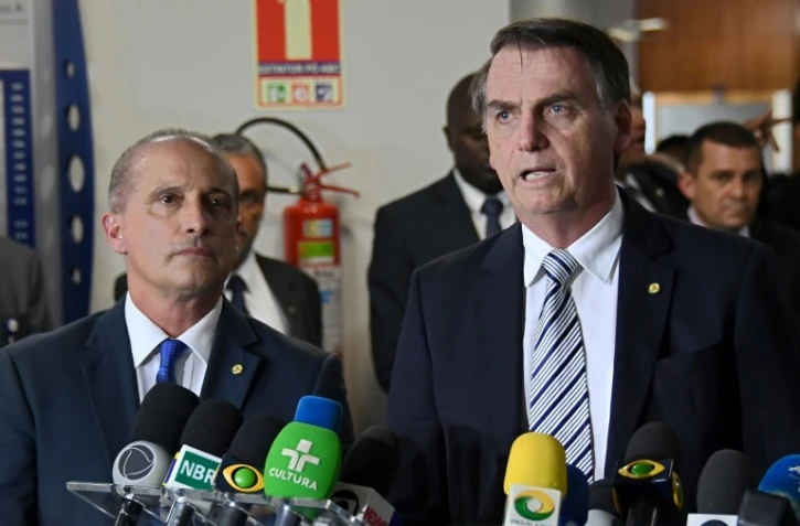 Le président élu Jair Bolsonaro (à droite) et son futur chef de cabinet Onyx Lorenzoni, le 20 novembre 2018 à Brasilia