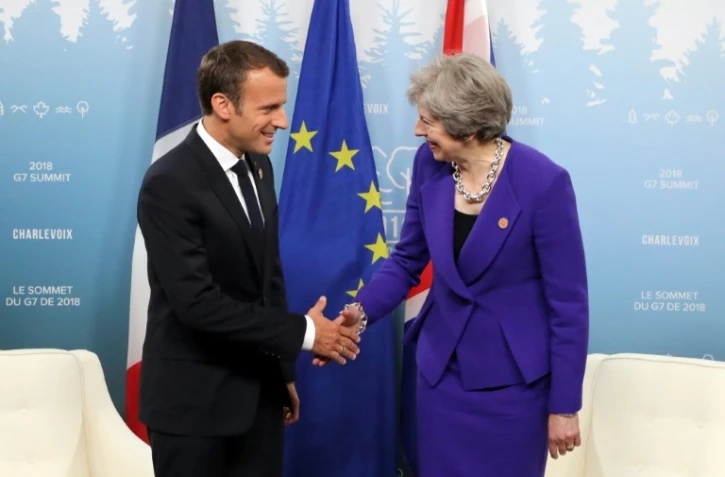 Le président français Emmanuel Macron et la Première ministre britannique Theresa May, lors du G7 à La Malbaie, au Québec, le 8 juin 2018