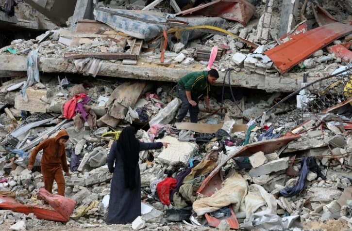 Des Gazaouis de retour dans leur quartier de al Zeitoun, au sud de Gaza-ville, le 9 février 2025