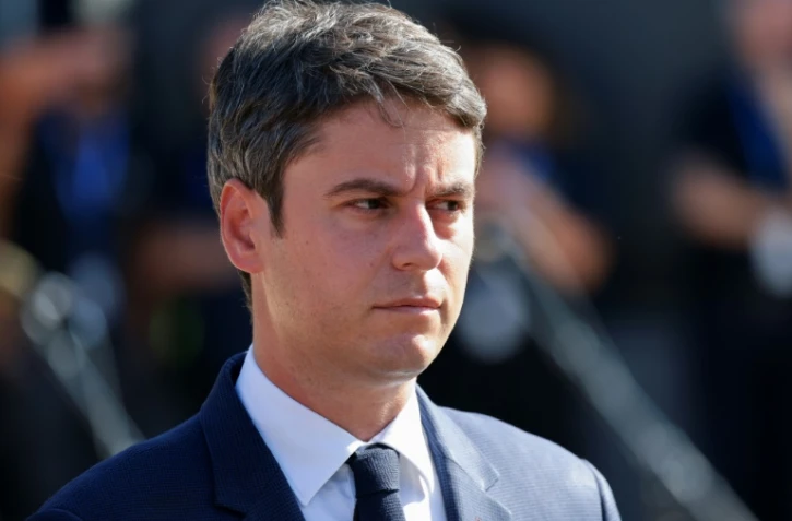 Le Premier ministre Gabriel Attal arrive pour assister au défilé du 14-Juillet, le 14 juillet 2024 à Paris