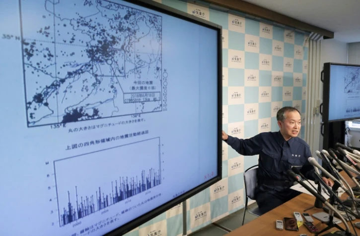 Un expert de l'agence météorologique japonaise lors d'une conférence de presse à Tokyo, le 18 juin 2018