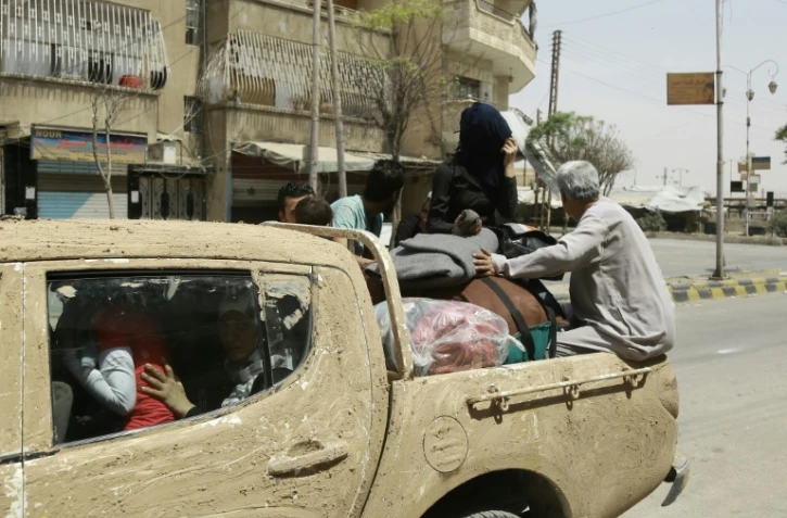 Des civils syriens fuient la ville de Hassaké, le 22 août 2016