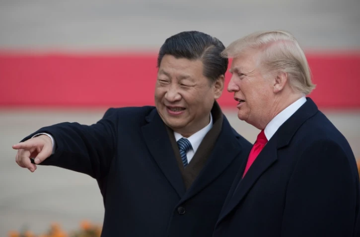 Le président américain Donald Trump (à droite) et son homologue chinois Xi Jinping, le 9 novembre 2017 à Pékin  