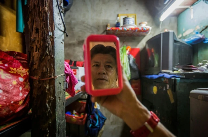 Pham Quoc Cong dans sa "micro-maison" de 2m2, le 2 mai 2018 à Ho Chi Ming-ville, au Vietnam