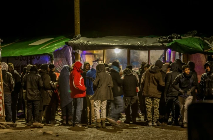Des migrants dans la "Jungle" le 2 mars 2016 Ă Calais