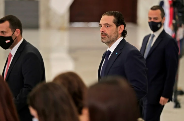 Saad Hariri (C), nommé Premier ministre du Liban pour la quatrième fois, arrive au palais présidentiel de Baabda à l'est de Beyrouth, le 22 octobre 2020