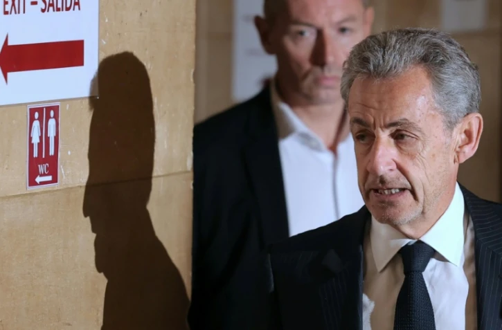 L'ancien président Nicolas Sarkozy arrive au palais de justice de Paris, le 7 avril 2026, pour son procès en appel dans l'affaire d'un financement libyen présumé de sa campagne présidentielle de 2007
