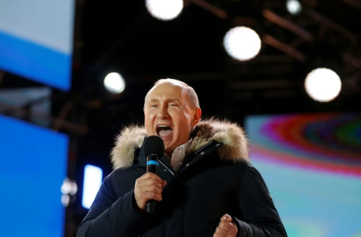 Le président russe Vladimir Poutine lors d'un rassemblement et un concert à Moscou pour le 4e anniversaire de l'annexion de la Crimée, le 18 mars 2018