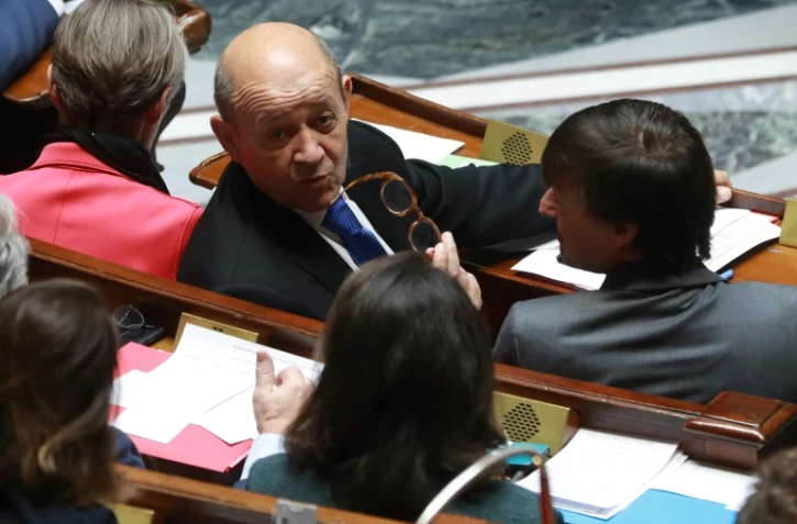 Le ministre des Affaires étrangères Jean-Yves Le Drian (c) à l'Assemblée nationale, le 6 mars 2018 à Paris