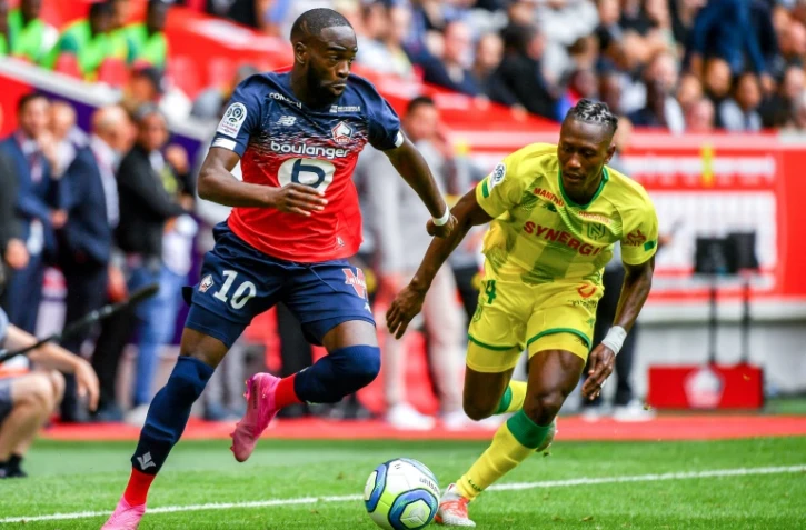 Jonathan Ikoné (g), attaquant de Lille, face au défenseur nantais Charles Traoré, le 11 août 2019 à Villeneuve-d'Ascq