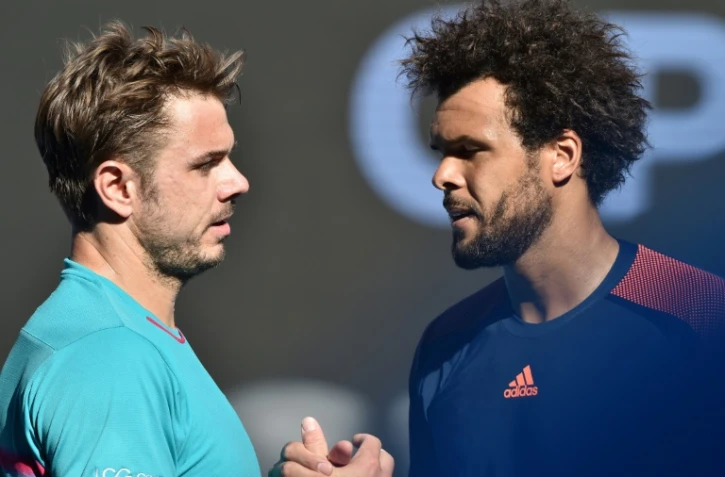 Stanislas Wawrinka (g) et  Jo-Wilfried Tsonga à l'issue des quarts de finale de l'Open d'Australie, le 24 janvier 2017 à Melbourne