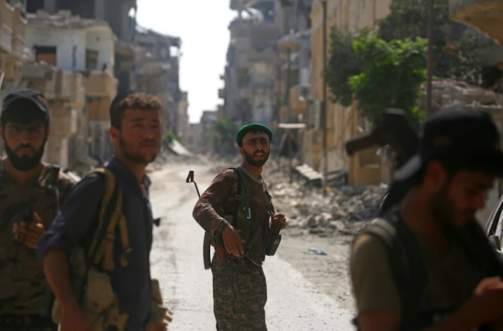 Des combattants des Forces démocratiques syriennes, le 21 septembre 2017 à Raqa